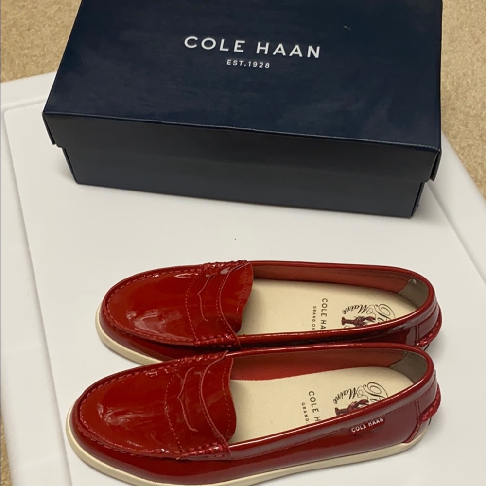 Red Patent leather pinch weekender. Cole Haan.